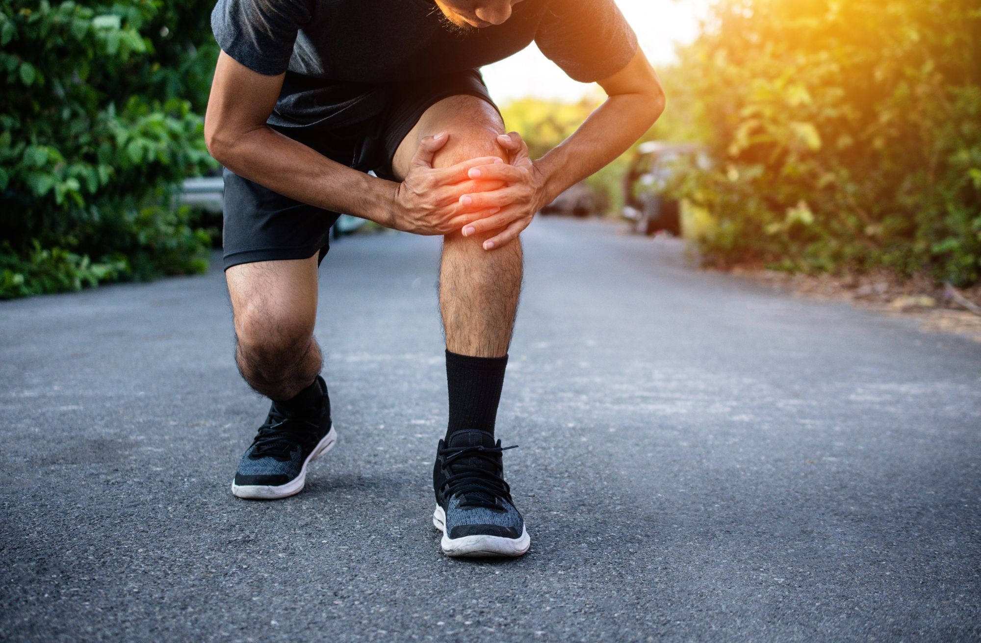 A man suffering from knee pain.