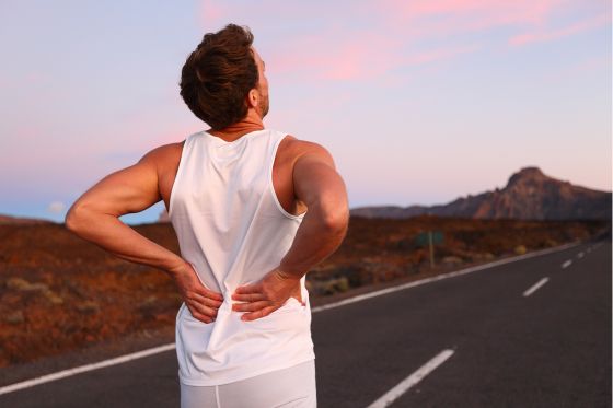 Man Suffering From Back Pain In Summer