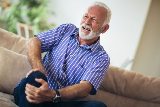 Man Suffering Chronic Pain Symptoms